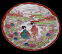 Image of a whole porcelain plate with the Geisha girl decoration. (Private collection)